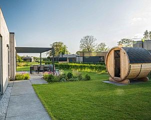 Geniet van de groene tuin bij Vakantievilla Amalia 6 met sauna in Kotten, Achterhoek, Gelderland.