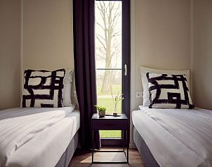 Tweede slaapkamer met uitzicht in Vakantievilla Amalia 6 met sauna, Kotten, Achterhoek, Gelderland.