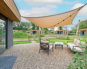 Parklodge 4 terras in Kotten, Achterhoek. Gezellige buitenruimte met zitplaatsen en uitzicht op de natuur.