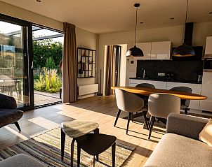 Interieur van Parklodge 4 in Kotten, Gelderland. Moderne keuken en eetruimte in vakantiehuis.