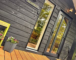 Ingang van Vakantiehuisje in Rekken met uitnodigende veranda in Achterhoek, Gelderland.