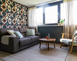 Comfortabele zithoek in Vakantiehuisje in Rekken met veel natuurlijk licht in Achterhoek, Gelderland.