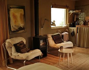 Comfortabele zithoek in Vakantiehuisje in Laren Gld met open haard, Laren, Achterhoek, Gelderland.