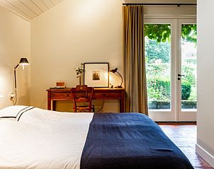 Slaapkamer in Huisje in Laren (GLD), vakantiehuis in de Achterhoek, Gelderland met toegang tot de tuin.