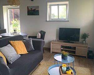 Gezellige woonkamer met zitgedeelte in Vakantiehuisje in Groenlo, Achterhoek, Gelderland.