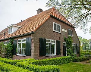 Charming vacation home in Lochem, Achterhoek, surrounded by green nature and rustic architecture in Gelderland.