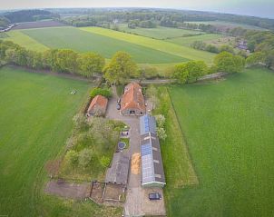 Aerial photo of Holiday home in Lochem, located in the green fields of the Achterhoek, Gelderland, overlooking extensive nature.