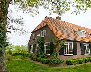 Vacation home in Lochem offers rustic charm in Achterhoek, Gelderland, surrounded by green nature and an inviting landscape.