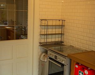 Cozy kitchen of Holiday Home in Lochem, Achterhoek, with modern appliances and country feel in Gelderland.