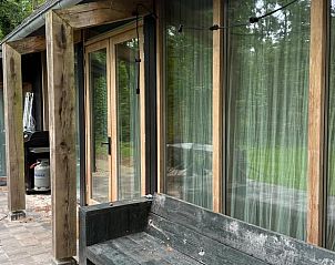 Cozy veranda of Holiday Home in Lochem, Achterhoek, Gelderland, overlooking the garden.