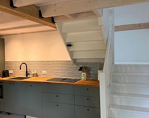 Kitchen and stairs in Holiday home in Lochem, Achterhoek, Gelderland, with stylish furnishings.