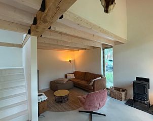 Modern living room in Holiday home in Lochem, Achterhoek, Gelderland, with wooden beamed ceiling.