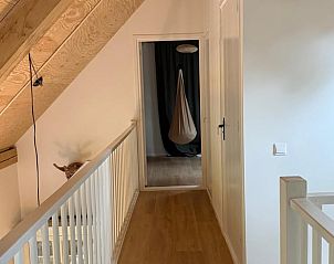 Corridor with wooden finish in Holiday home in Lochem, Achterhoek, Gelderland, with access to rooms.
