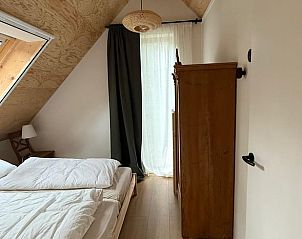 Bedroom in attic in Holiday Home in Lochem, Achterhoek, Gelderland, with wooden interior.