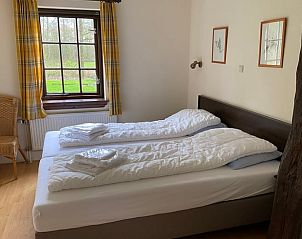 Gezellige slaapkamer in Huisje in Hengelo met uitzicht op de natuur.