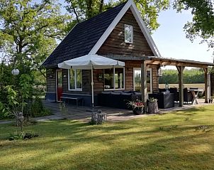 Zonnige veranda van Vakantiehuisje in Hengelo GLD, Varssel, Bronckhorst in de Achterhoek, Gelderland.