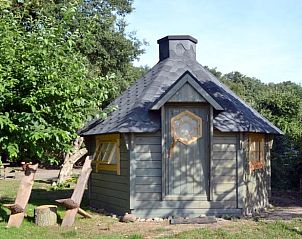 Charmante houten vakantiewoning in Haarlo, Achterhoek, omgeven door groen en rust.