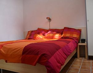 Sfeervolle slaapkamer in Vakantiehuis in Wichmond, perfect voor een rustgevende nacht in de Achterhoek, Gelderland.