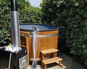 Wooden hot tub at Holiday home in Vorden, Achterhoek, for a luxurious stay in Gelderland.