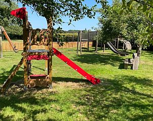 Colorful play tower in the garden of Holiday home in Vorden, child-friendly vacation home in the Achterhoek.