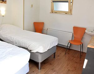 Bedroom with two beds in Holiday home in Vorden, ideal for families in Achterhoek, Gelderland.