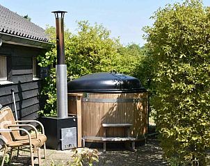 Slaapkamer met houten vloer in DG126-6 vakantiehuis Vorden Achterhoek