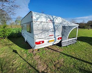 Vakantiehuis in Lichtenvoorde, Achterhoek, Gelderland, biedt een charmante buitenruimte voor ontspanning.