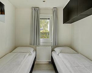 Gezellige slaapkamer met twee eenpersoonsbedden in vakantiehuis Lichtenvoorde, Achterhoek.