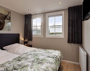 Tweede slaapkamer in Notario 4 personen Wellness, vakantiehuis in Lichtenvoorde, Achterhoek, met sfeervolle inrichting en uitzicht op de natuur.