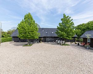 Vakantiehuis in Zeddam, een charmante vakantiewoning in de Achterhoek, Gelderland, omgeven door groene natuur en rustieke architectuur.
