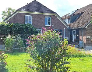 Buitenkant van Huisje in Breedenbroek Achterhoek, vakantiehuis in Gelderland omgeven door groen.