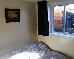 Knusse slaapkamer in Vakantiehuis in Almen, ideaal voor ontspanning in de Achterhoek, Gelderland.