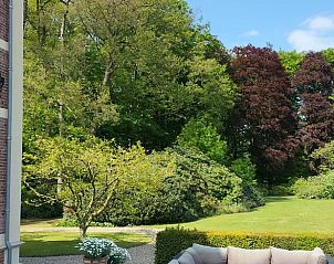 Groene tuin bij Vakantiehuisje in Winterswijk Woold biedt ontspanning in de Achterhoek, Gelderland.