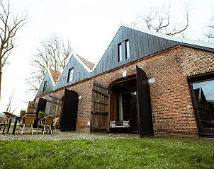 Ruim terras bij Huisje in Winterswijk Woold, vakantiehuis in de Achterhoek, perfect voor buiten dineren.