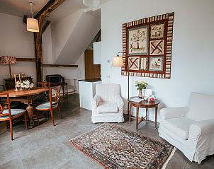 Stijlvolle woonkamer in Huisje in Winterswijk Woold, vakantiehuis in de Achterhoek, met gezellige inrichting.