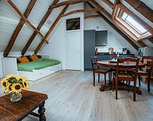 Gezellige binnenruimte van Vakantiehuisje in Winterswijk Woold, met keuken en eethoek, Achterhoek, Gelderland.