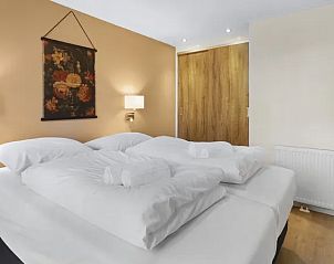 Comfortabele slaapkamer in De Vlinderhoeve bungalow, Kring van Dorth, met warme inrichting, Achterhoek.