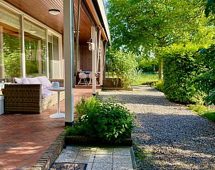 Enjoy the serene veranda of Holiday Home in Joppe, located in the green Achterhoek, Gelderland.