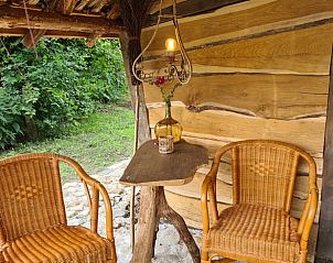 Gezellige veranda met zitjes in Vakantiehuis in Winterswijk Corle, Achterhoek.