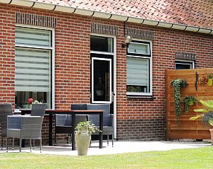 Terras met zitgelegenheid bij Vakantiehuis in Winterswijk Corle, ideaal voor ontspanning in Achterhoek, Gelderland.