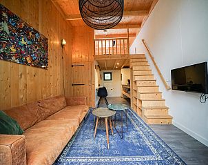 Cozy interior of the detached house in Beekbergen, Veluwe, Gelderland, with wooden interior and comfortable sitting area.