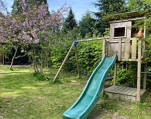 Playground at Holiday home in Beekbergen, Veluwe, with slide and natural surroundings in Gelderland.
