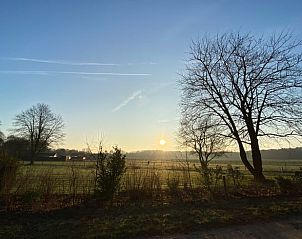 Breathtaking view at sunrise from Holiday home in Beekbergen, Veluwe, with vast fields in Gelderland.