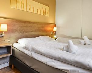 Gezellige slaapkamer met tweepersoonsbed in Heideheuvel kinderbungalow, Beekbergen, Veluwe.