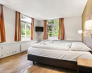 Comfortabele slaapkamer in Heideheuvel bungalow, Beekbergen met luxe beddengoed.