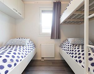 Slaapkamer in Parel 5 personen Wellness vakantiehuis, Ede, Veluwe. Comfortabele bedden met moderne inrichting voor een ontspannen verblijf.