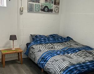 Comfortabele slaapkamer in Huisje in Ede, vakantiehuis op de Veluwe, Gelderland.