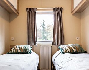 Gemtliches Doppelzimmer im Ferienhaus fr 5 Personen, Ede, Veluwe, Gelderland mit Blick auf den Wald.