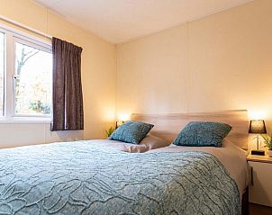 Comfortable bedroom in vacation home for 6 people in Ede, Veluwe, Gelderland with large window.