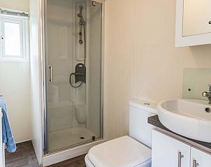 Modern bathroom in Holiday home 6 people in Ede, Veluwe with shower and sink.